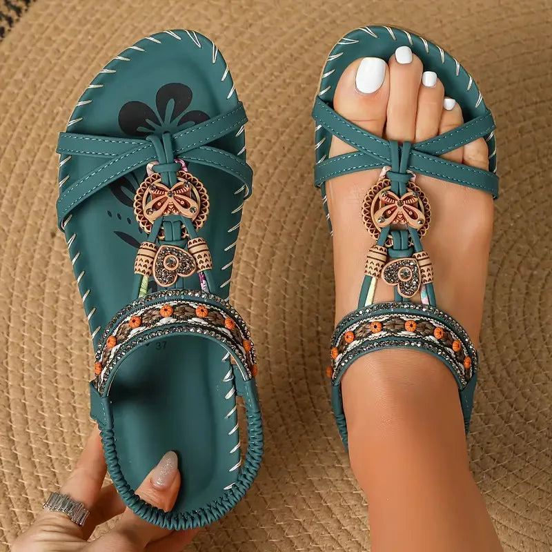 Women's brown bohemian flat sandals with decorative beaded straps and open toe design