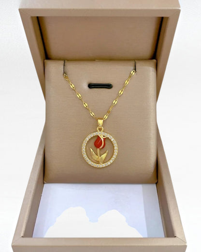 Red rose pendant necklace with gold-tone stainless steel chain and sparkling circular floral pendant